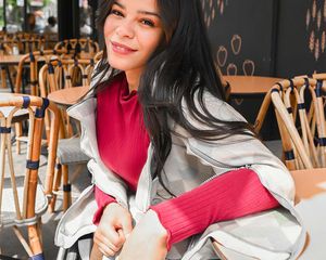 Model in wheelchair sitting at a cafe