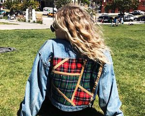 Girl With Blonde Hair Sitting On The Grass