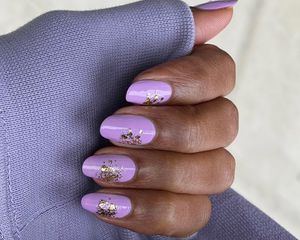 Person with pastel purple nails.