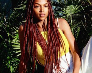person with red box braids