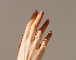 Close up of a woman's manicured hand.