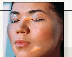 AAPI Woman with Eyes Closed Wearing Glittery Star Eyeshadow in Pastel Rainbow Shades 