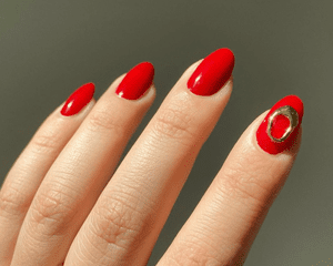 red nails with gold accent