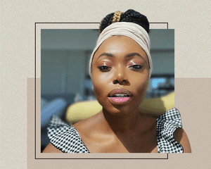 WoC Photographed Looking at the Camera on a Designed Background